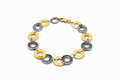 Pulsera Eslabones circulares de oro blanco y amarillo